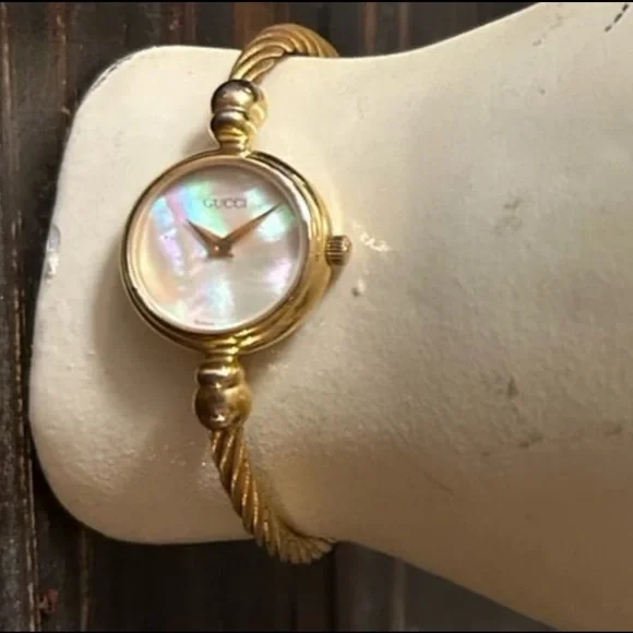 Gucci vintage women's watch wrap cable band with pearl face
In working order! - Picture 1 of 8